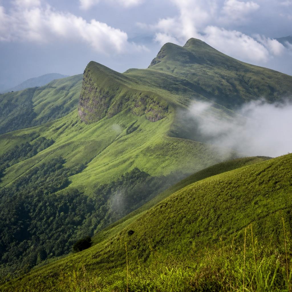 Lush green rolling hills of Kudremukha peak in Karnataka Western Ghats