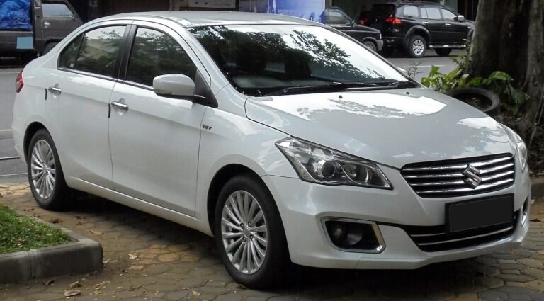 A white sedan car parked outdoors
