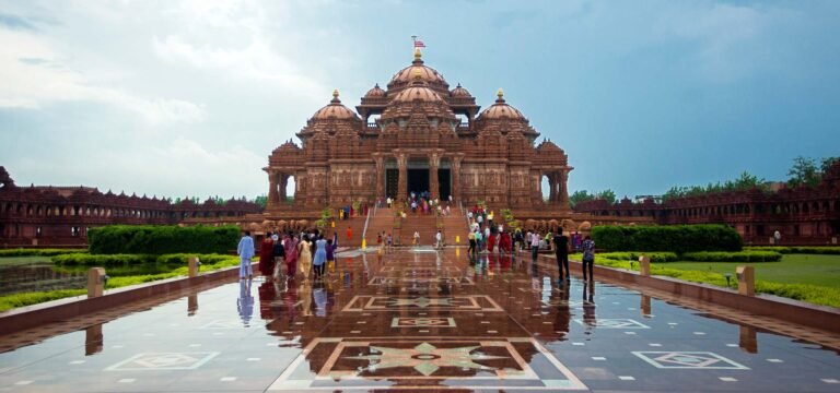 An intricately carved stone temple with a tall, ornate entrance